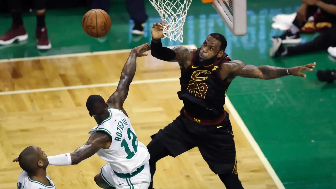 Close‑up basketball play at the rim representing fast access to live sports after 1xBet Download